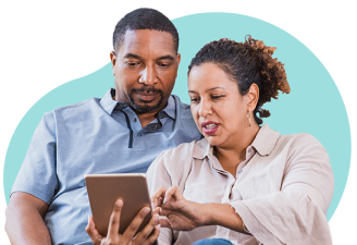 Two people looking at a tablet