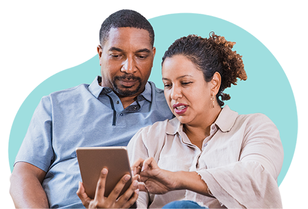Two people looking at a tablet